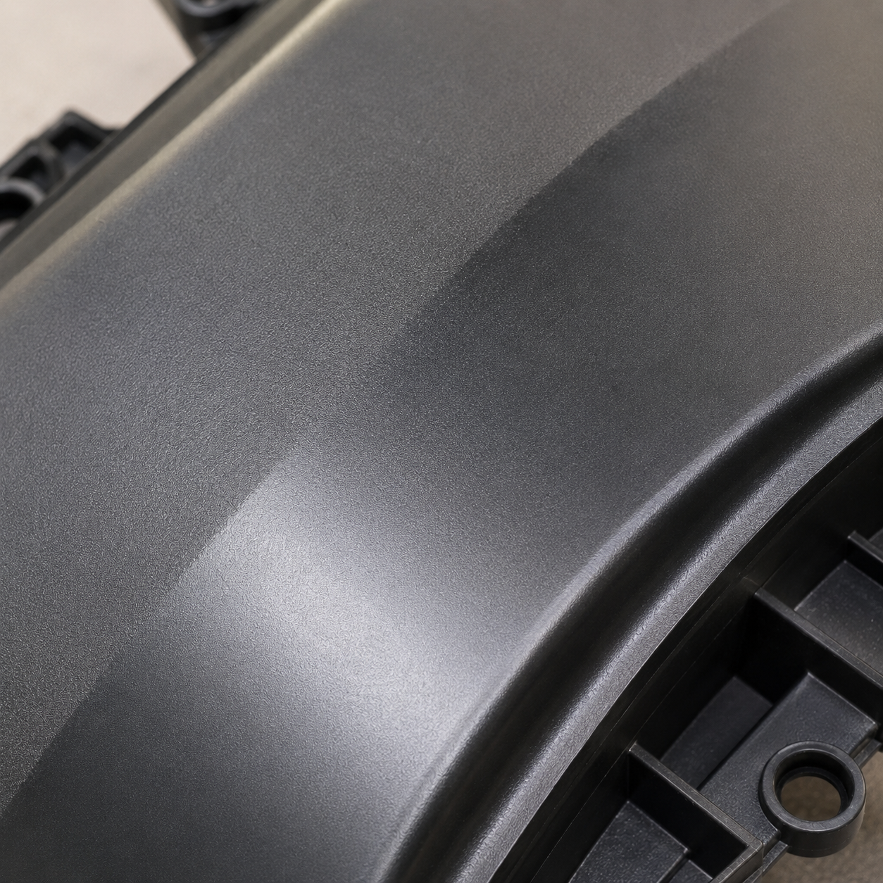 Gloss variation across a moulded surface